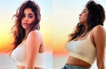 Janhvi Kapoor is giving us summer vibes already in a stylish white crop top and jeans