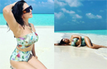 Just Sunny Leone looking sensational in a floral swimsuit in the middle of Maldives