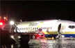 Boeing 737 with 136 on board skids on runway, falls into river in US