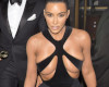 Kim Kardashian wears incredibly booby dress on red carpet and exposes her breasts