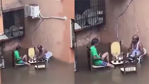 Men having drinks amid heavy rain water 