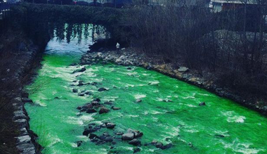 River turns incredible bright green colour sparking fears it could be ...