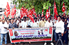 Massive rally by construction workers demands permanent solution to red stone and sand crisis in DK
