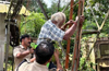 Kasargod: 74-year-old climbs mobile tower, threatens suicide over land documents