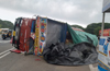 Driver injured as truck carrying cashew nuts overturns at Balayipade