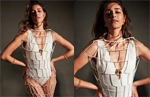 Ananya Panday is making jaws drop in her white swimsuit and cutout net coverup