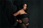 Mom-to-be Bipasha Basu shows her baby bump in a sheer black flowing dress