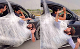 Man hangs from moving car’s door with plastic wrap, video goes viral