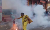 Video of elderly woman holding lit firecrackers like a pro leaves Internet divided, Watch