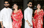 New bride Mouni Roy in gorgeous red saree & gold jhumkas poses with Suraj Nambiar at Mumbai airport