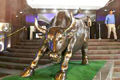 Sensex surges over 21,000 level as exit polls suggest BJP win