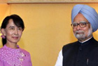 Manmohan meets Suu Kyi, invites her to visit India