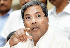 Siddaramaiah asks officials to pull up socks