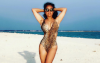 Salma Hayek, 52, cuts a fierce figure in cutout leopard print swimsuit